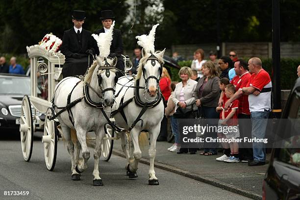 The double coffin of brothers Arron, 10 and Ben Peak arrives at Our Lady of Lourdes Church on June 27 in Partington, England. Ben and Arron from...