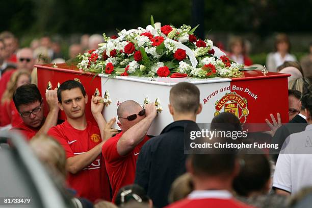 The double coffin of brothers Arron, 10 and Ben Peak arrives at Our Lady of Lourdes Church on June 27 in Partington, England. Ben and Arron from...