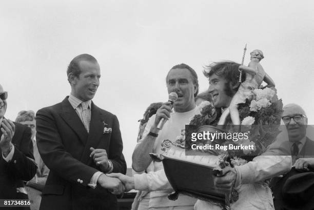 Jackie Stewart wins the British Grand Prix at Silverstone, 19th July 1969. The Duke of Kent presents him with his trophy.