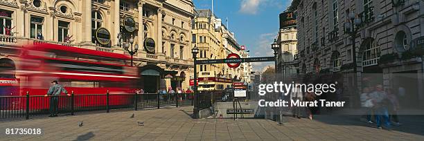 piccadilly circus subway station entrance and street scene, london, england - london underground train stock pictures, royalty-free photos & images