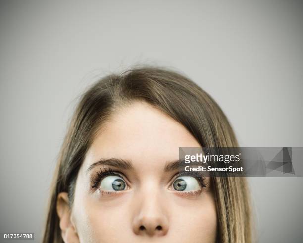 real young woman with crossed eyes - insanity stock pictures, royalty-free photos & images