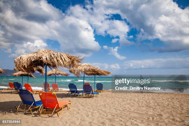 sunloungers on ammoudara beach near heraklion, crete, greece, mediterranean - herakleion stock pictures, royalty-free photos & images