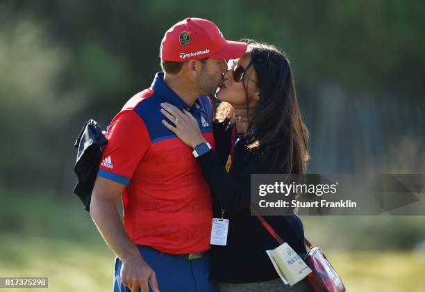 Sergio Garcia of Spain kisses his fiancee Angela Akins during a practice round prior to the 146th Open Championship at Royal Birkdale on July 18,...