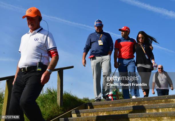 Thomas Bjorn of Denmark chats to Sergio Garcia of Spain and Angela Akins during a practice round prior to the 146th Open Championship at Royal...