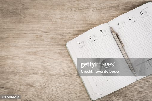 Calendar, smartphone, tablet. Workplace with tablet pc and smartphone on table close-up Calendar, smartphone, tablet. Workplace with tablet pc and smartphone on table close-up