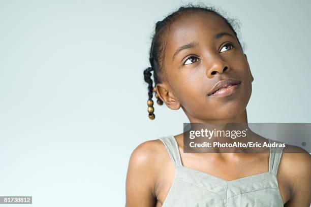 little girl looking up, head and shoulders, portrait - children hope stock pictures, royalty-free photos & images