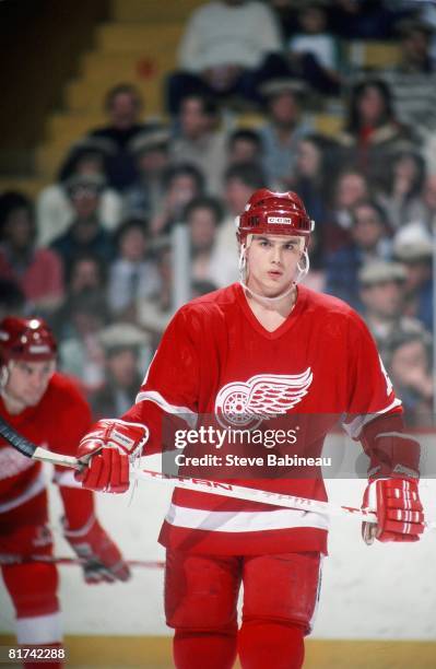 Rookie Steve Yzerman of the Detroit Red Wings skates in game at the Boston Garden against the Boston Bruins .