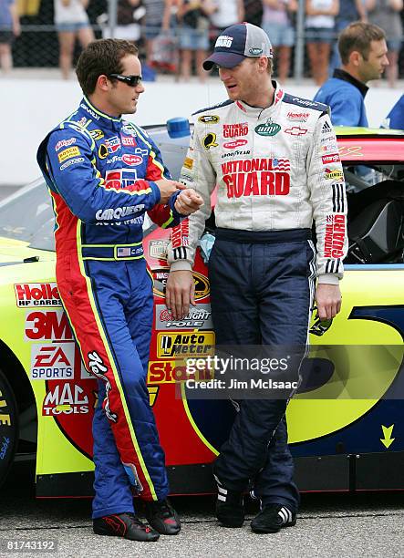 Casey Mears, driver of the Kellogg's/CARQUEST Chevrolet, talks with Dale Earnhardt Jr., driver of the National Guard/AMP Energy Chevrolet, during...