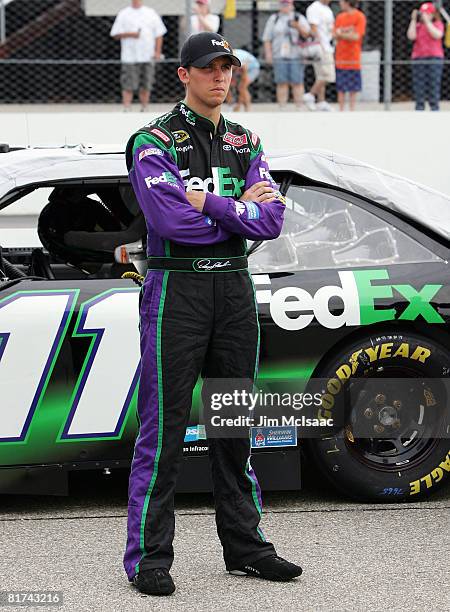 Denny Hamlin, driver of the FedEx Ground Toyota, waits on pit road during qualifying for the NASCAR Sprint Cup Series LENOX Industrial Tools 301 at...