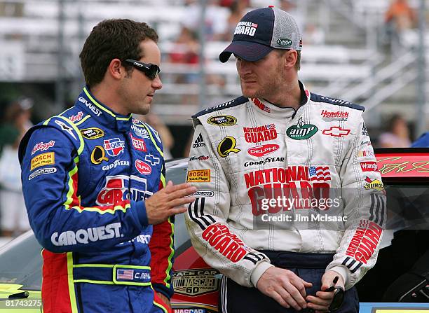 Casey Mears, driver of the Kellogg's/CARQUEST Chevrolet, talks with Dale Earnhardt Jr., driver of the National Guard/AMP Energy Chevrolet, during...