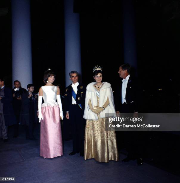 Jacqueline Kennedy and President John F. Kennedy attend a dinner in Honor of the Shah and Empress of Iran April 11, 1962 at the White House in...