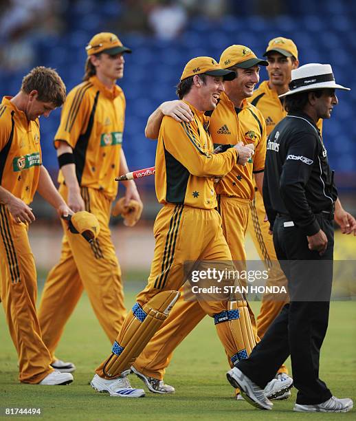 The Australian cricket team walks off the pitch June 27, 2008 at National Stadium in St. Georges, Grenada at the end of their One-Day International...