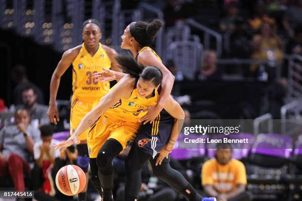 Candace Parker of the Los Angeles Sparks handles the ball against Marissa Coleman of the Indiana Fever during a WNBA basketball game at Staples...