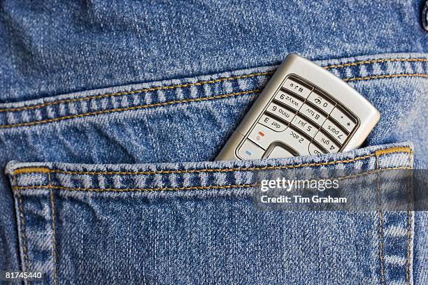 Mobile phone in jeans pocket