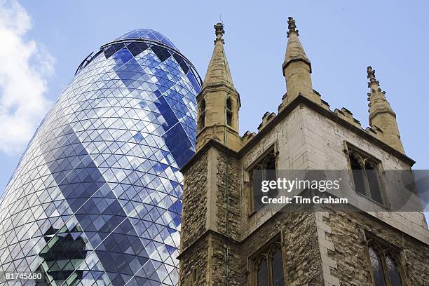 St Andrew Undershaft Church in front of the Swiss Re Building, London, England, United Kingdom