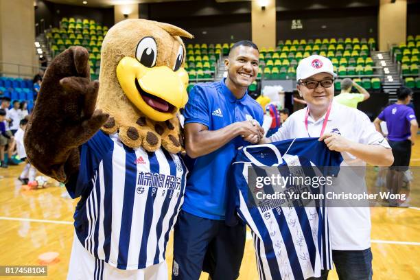 West Bromwich Albion forward Salomon Rondon presents the gift to a blogger during the Premier League Asia Trophy Skills Session at Macpherson Stadium...