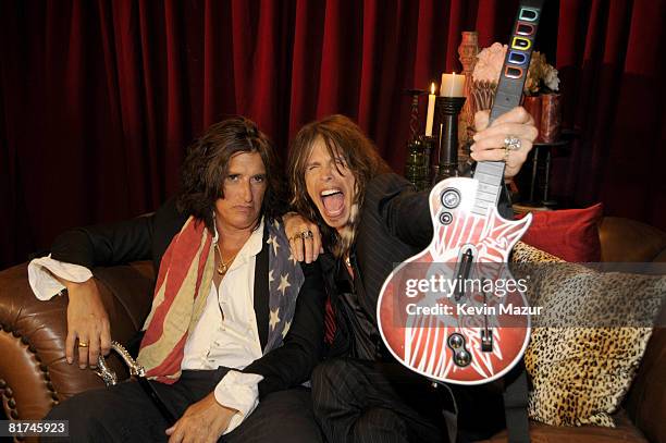 Joe Perry and Steven Tyler of Aerosmith celebrate the launch of Aerosmith Guitar Hero at Hard Rock Cafe on June 27, 2008 in New York City.