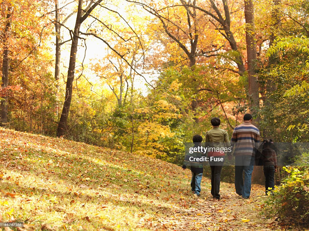 Family Walking in Fall Foliage