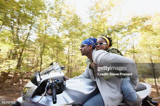 couple on motorcycle - steve prezant stock pictures, royalty-free photos & images