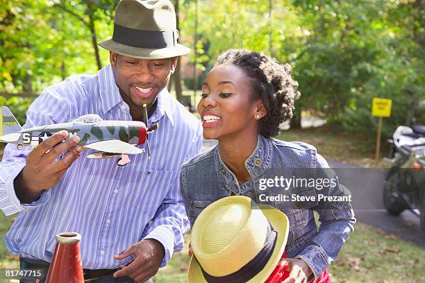 couple at garage sale - steve prezant stock pictures, royalty-free photos & images