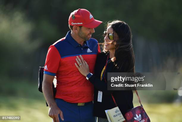 Sergio Garcia of Spain and fiancee Angela Akins embrace during a practice round prior to the 146th Open Championship at Royal Birkdale on July 18,...