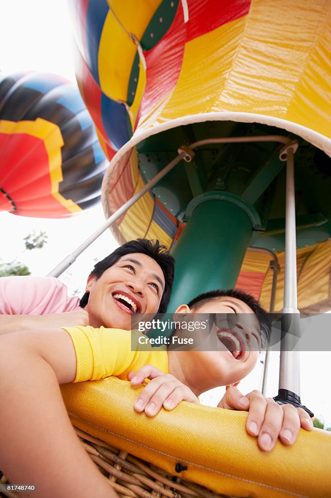 Father and Son Riding Amusement Ride