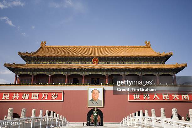 Soldier stands infront of Chairman Mao's portrait at Gate of Heavenly Peace, Entrance to the Forbidden City, China