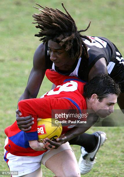 Nick Naitanui of the Swans tackles Troy Longmuir of the Falcons during the WAFL match between the Swan Districts Swans and West Perth Falcons held at...