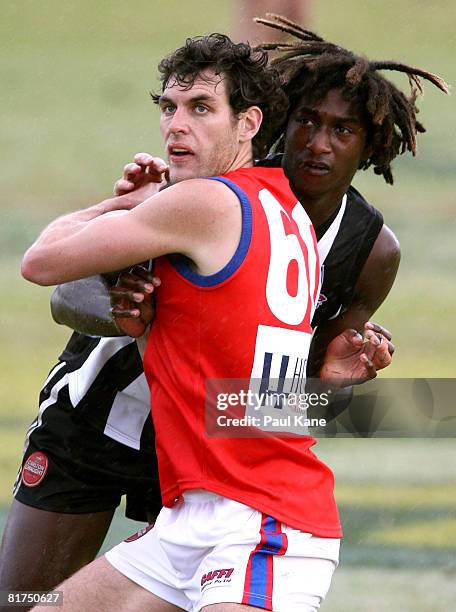 Nick Naitanui of the Swans contests the ruck against Mark Seaby of the Falcons during the WAFL match between the Swan Districts Swans and West Perth...