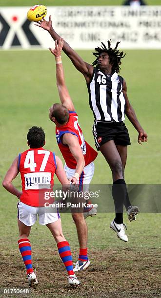 Nick Naitanui of the Swans wins a ruck contest against Kepler Bradley of the Falcons during the WAFL match between the Swan Districts Swans and West...