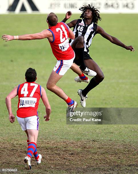 Nick Naitanui of the Swans contests the ruck against Kepler Bradley of the Falcons during the WAFL match between the Swan Districts Swans and West...