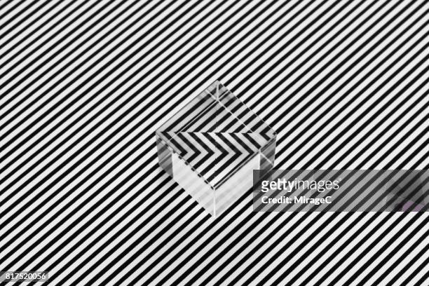 cube prism on black and white stripes illusion - black cube stock pictures, royalty-free photos & images