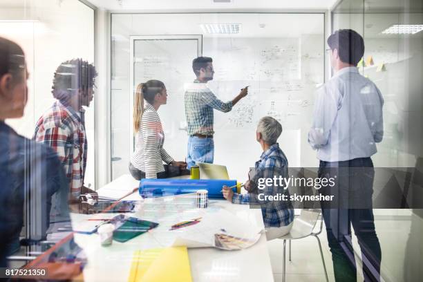 planning a business strategy! - engineers brainstorming stock pictures, royalty-free photos & images