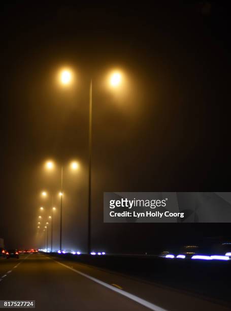 motorway street lamps and car headlights at night - lyn holly coorg - fotografias e filmes do acervo