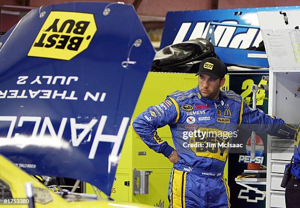 Elliott Sadler, driver of the Best Buy/Hancock Dodge, waits in the garage during practice for the NASCAR Sprint Cup Series LENOX Industrial Tools 301...