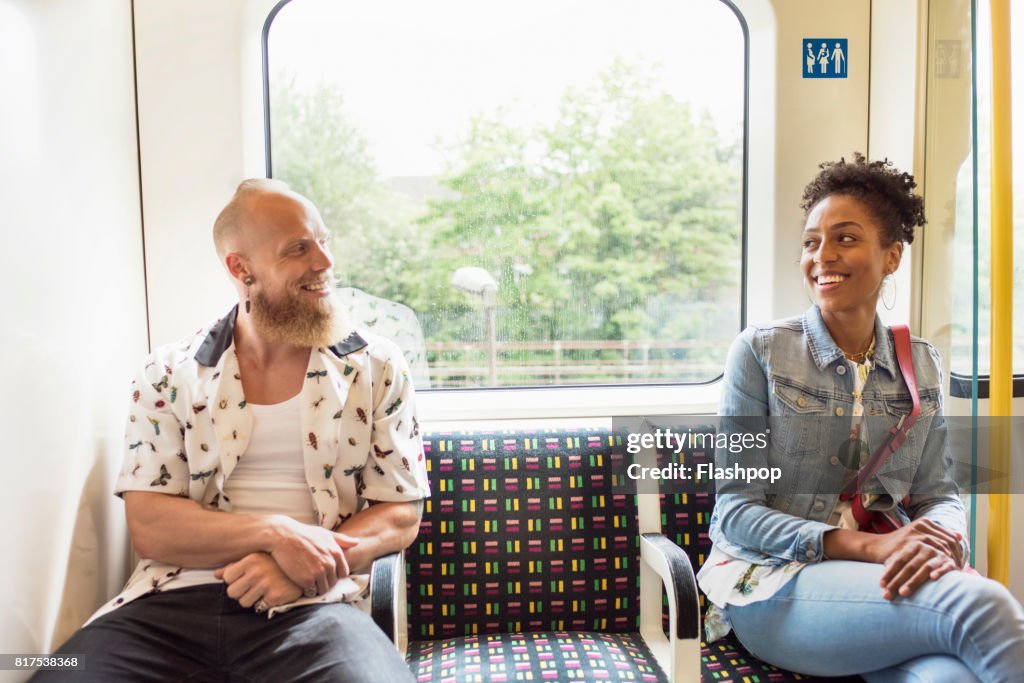 Couple flirting on train