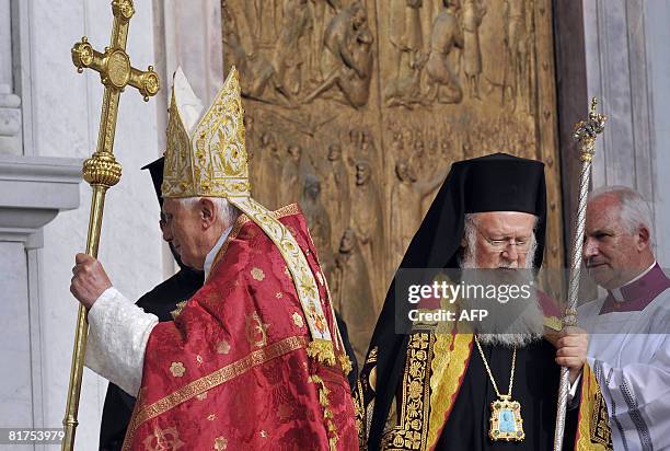 Pope Benedict XVI arrives with the patriarch of the Greek church Bartholomaios I for the St. Paul first Vespers prayer at the Rome's Basilica of St....