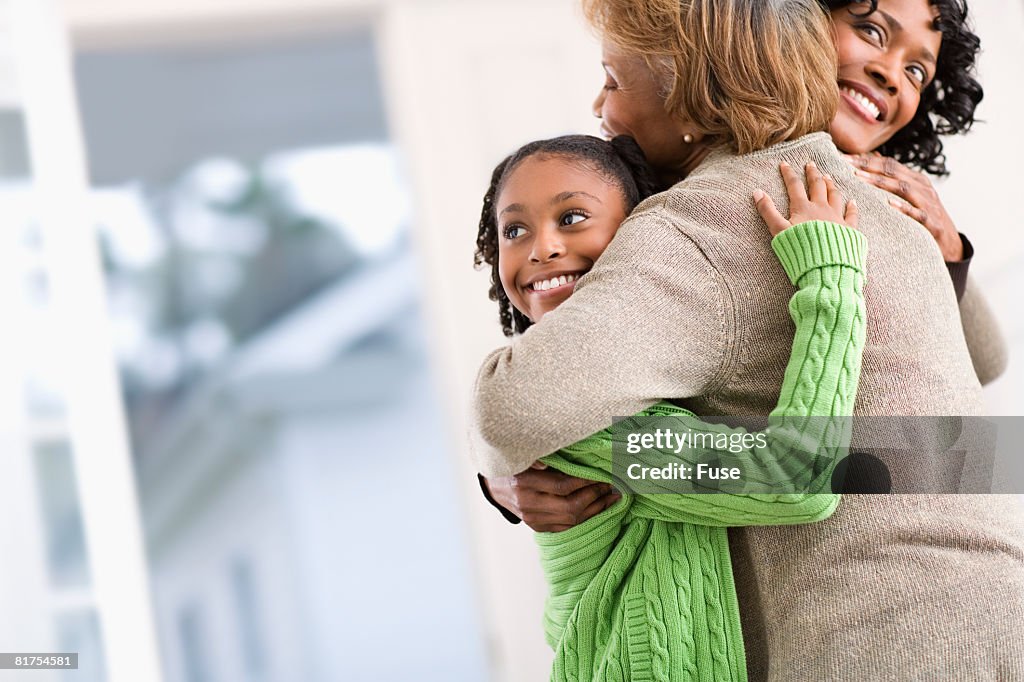 Grandmother, Daughter and Granddaughter Hugging