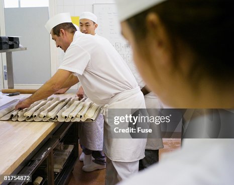 Culinary Students Watching Instructor Shape Dough Culinary Students Watching Instructor Shape Dough