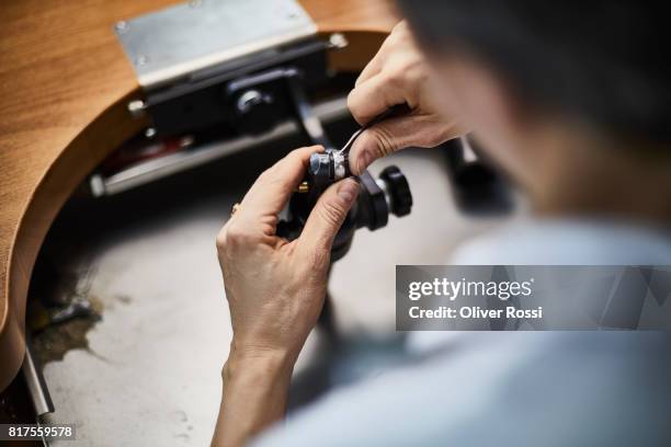 detail of goldsmith at work in her workshop - jeweller bildbanksfoton och bilder