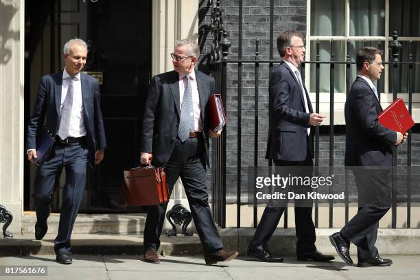 Britain's Environment, Food and Rural Affairs Secretary Michael Gove, Britain's Attorney General Jeremy Wright and Britain's Northern Ireland...