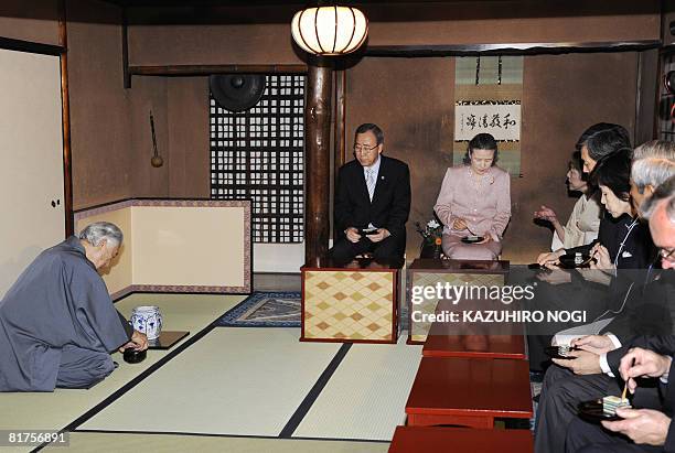 Secretary General Ban Ki-Moon and his wife Yoo Soon-taek attend a tea ceremony presented by Sen Genshitsu , former grand master of the Urasenke at...