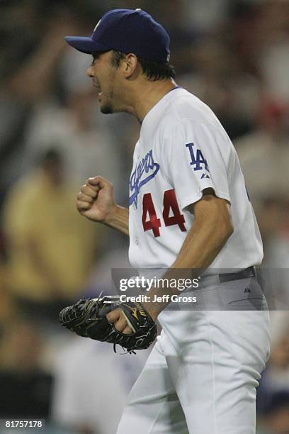 Takashi Saito of the Los Angeles Dodgers celebrates after the interleague game against the Los Angeles Angels of Anaheim at Dodger Stadium on June...