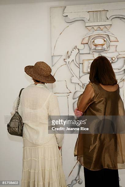 Chris Wagner and Geraldine Clark attend the Trigg Ison Fine art exhibit for the work of Maxine Kim Stussy-Frankel at her home June 28, 2008 in Los...