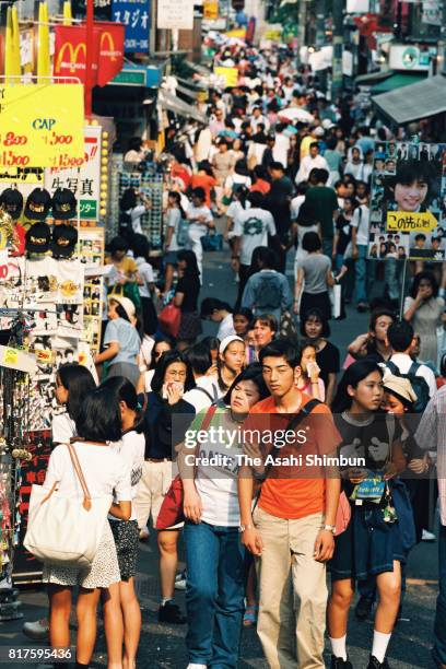 Takeshita Street is packed with tourists on August 3, 1994 in Tokyo, Japan.