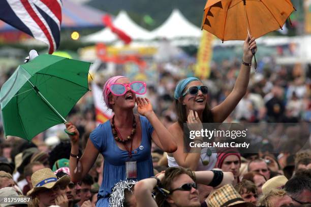 The crowd cheers Newton Faulkner as he performs on the Other Stage Glastonbury Festival at Worthy Farm, Pilton on June 29 2008 in Glastonbury,...