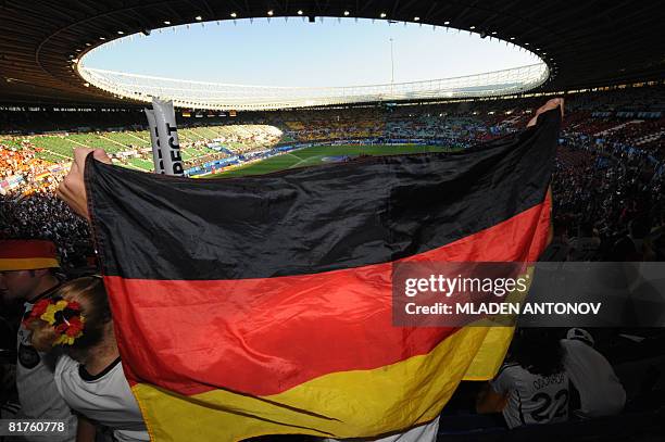 German fans wave a German flag before the Euro 2008 championships final football match Germany vs. Spain on June 29, 2008 in the stands of the...