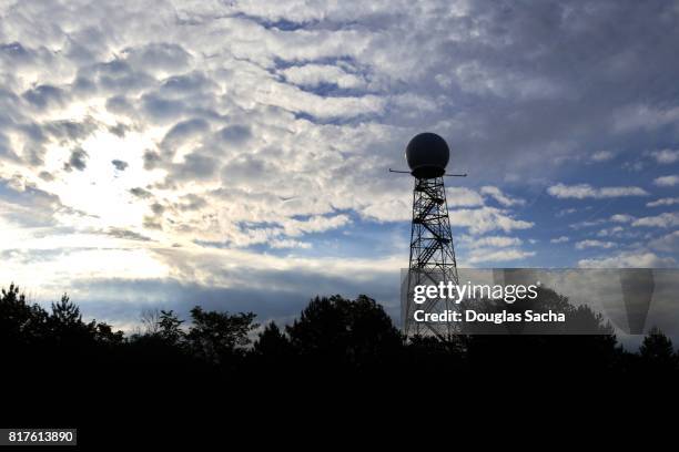 silhoutte of a doppler weather radar tower - rodar stock pictures, royalty-free photos & images