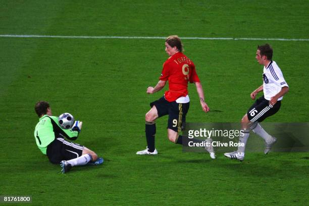Fernando Torres of Spain scores the opening goal past German goalkeeper Jens Lehmann during the UEFA EURO 2008 Final match between Germany and Spain...