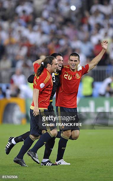 Spanish forward Sergio Garcia, Spanish goalkeeper Andres Palop and Spanish defender Juanito celebrate after the Euro 2008 championships final...